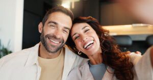 Couple, portrait and happy with selfie in home for social media post, bonding together and connection
