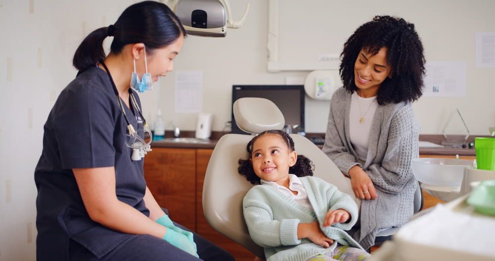 Girl, smile and dentist for consultation with discussion, oral hygiene and mouth cleaning service.