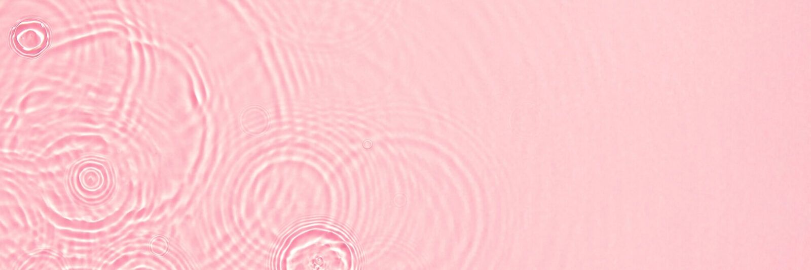 Abstract summer banner background Transparent pink clear water surface texture with ripples, splashes and bubbles.
