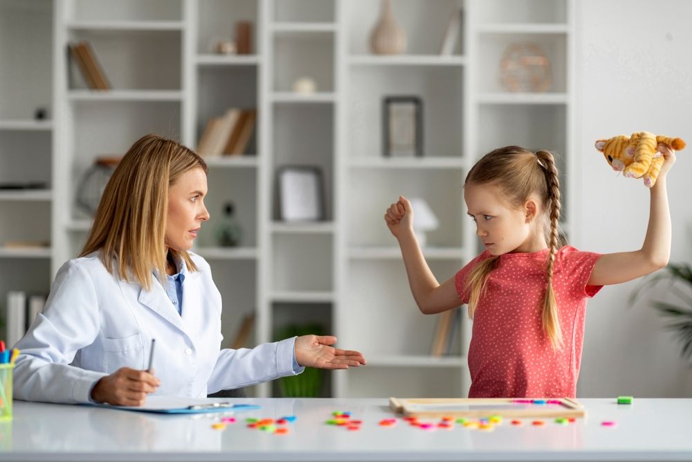 Disobedient bad tempered little girl throwing tantrum at appointment meeting with psychologist