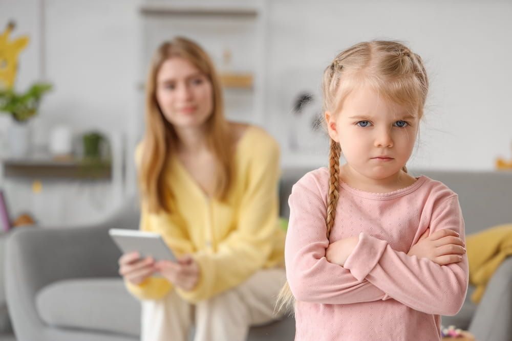 Upset little girl at psychologist's office, closeup