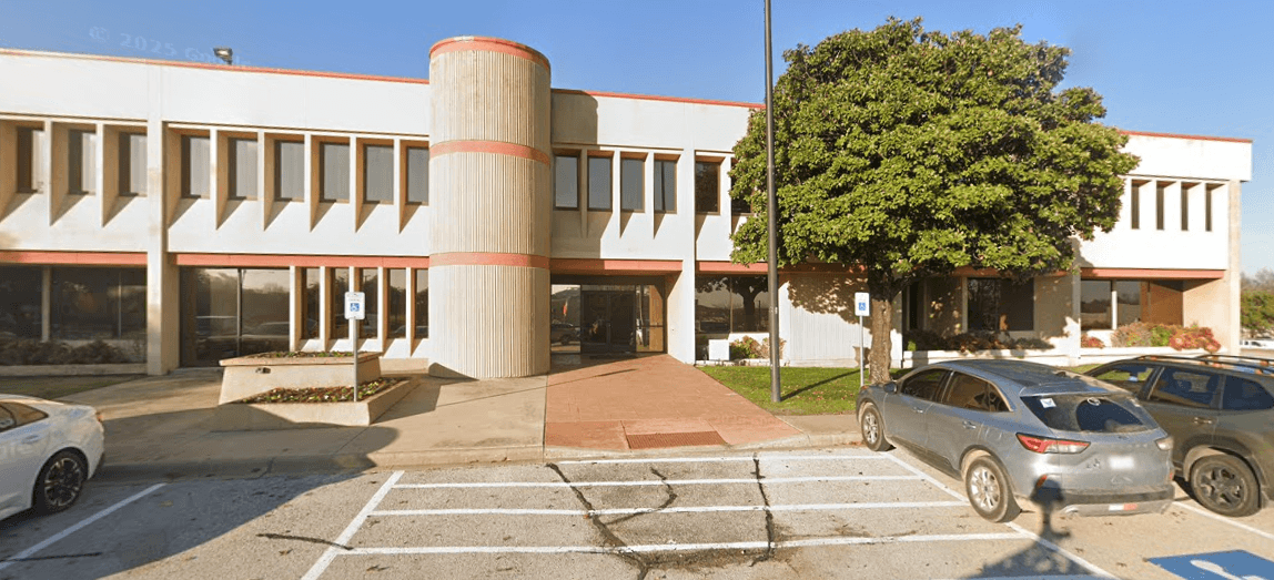 office building with cars parked