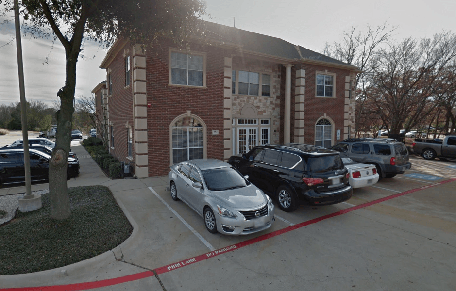 office building with cars parked