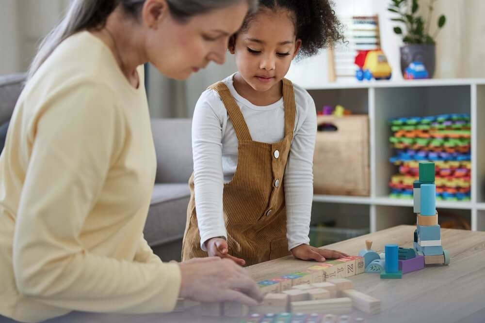 Therapist, child and development with toys for education, learning behavior and assessment for adhd.
