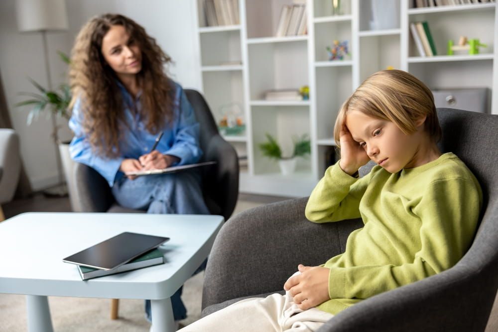 Blonde boy demonstrating negative attitude to speech therapy