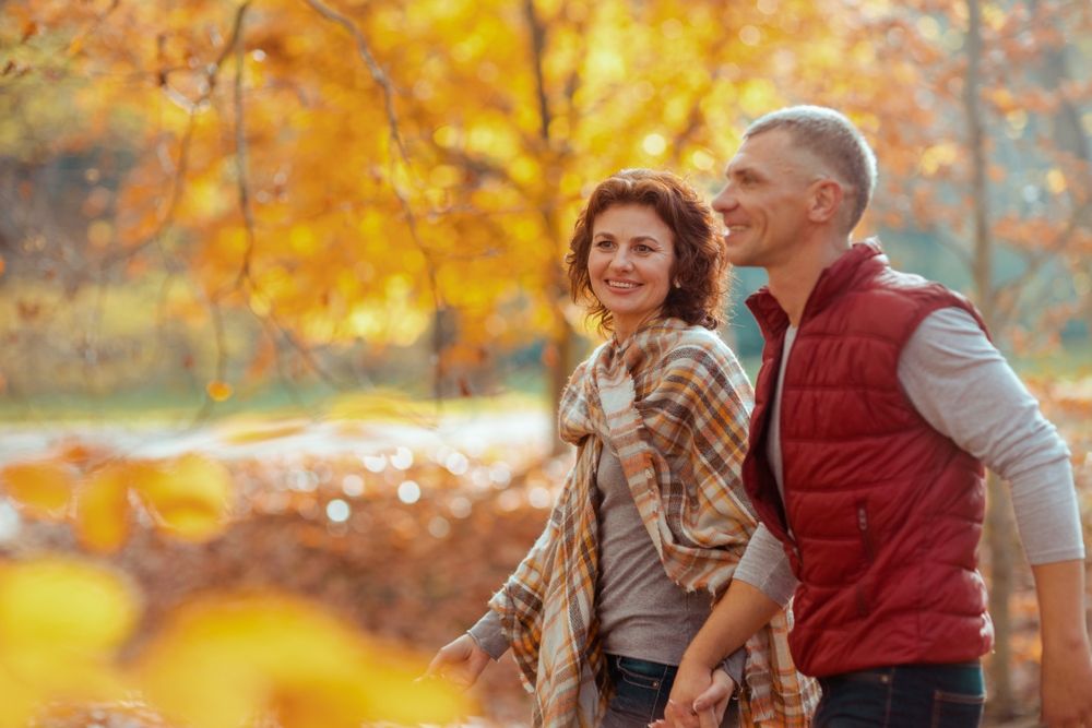 hormones in fall, Smiling Modern Couple In, the Park Walking