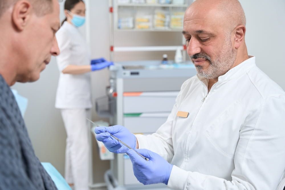 Doctor consults a man before an operation in specialized clinic,