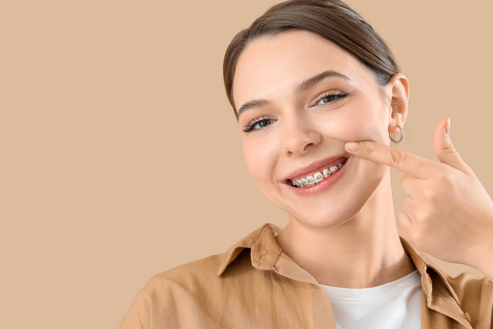 Young woman with dental braces smiling