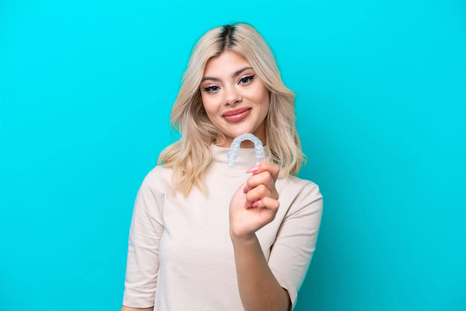 Young Russian woman holding invisaling