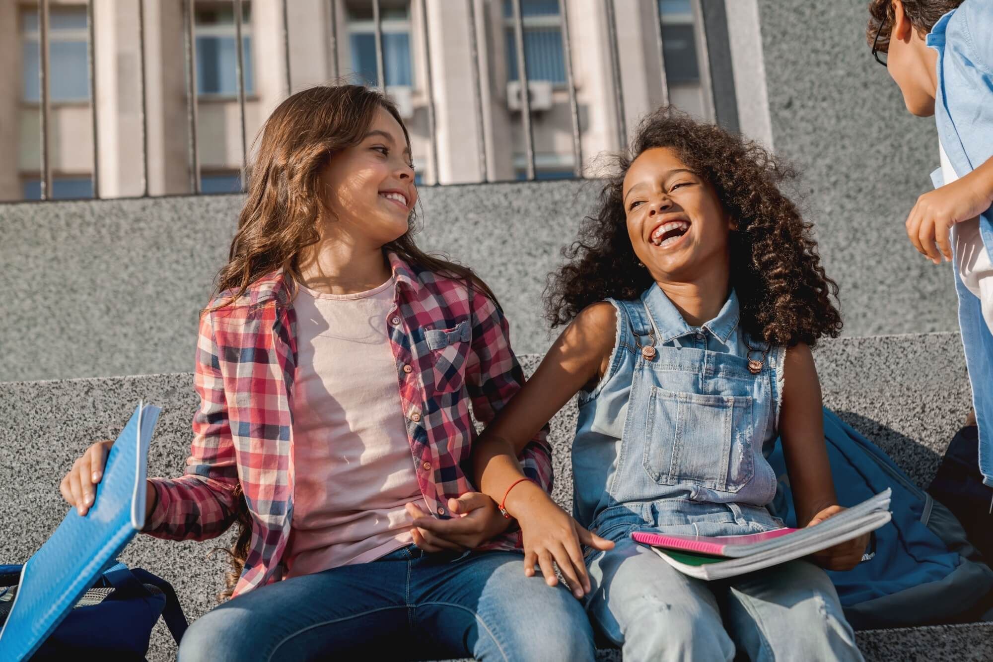 Portrait of cheerful positive school pupils friends preteen boys and girls classmates laughing