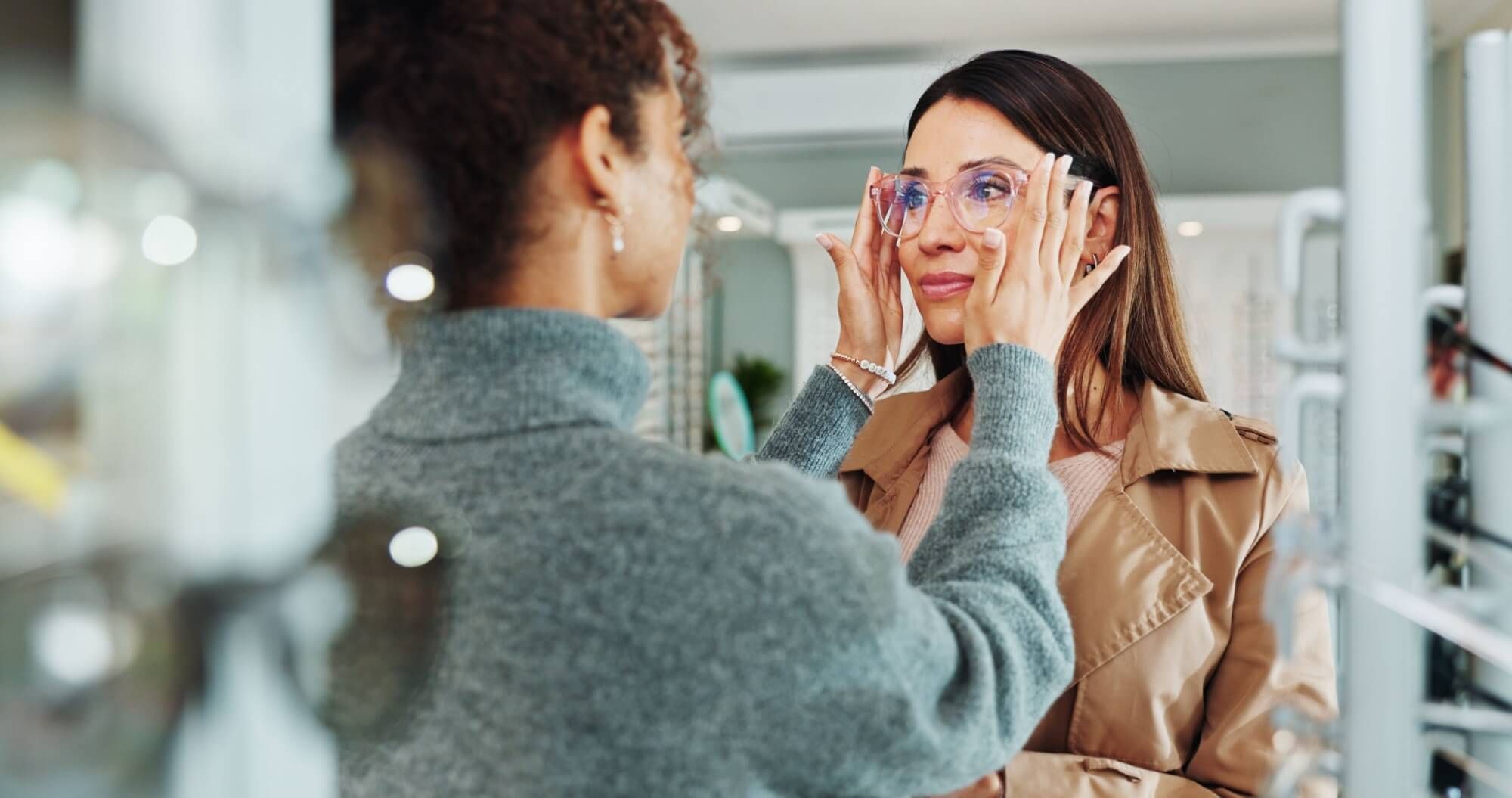 woman and customer with glasses shopping for vision, frame style or prescription lens in retail store.
