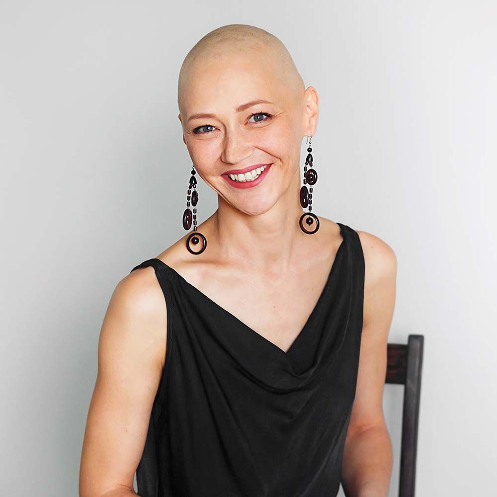 pretty bald woman in black dress