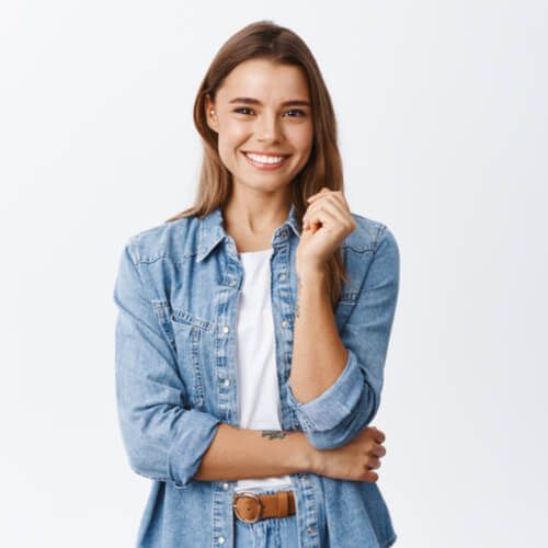 Happy successful woman standing in casual outfit