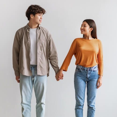 Asian couple smiling and looking at each other