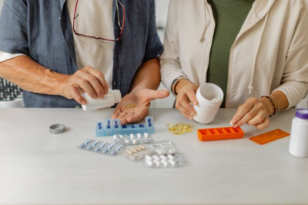 Unrecognizable couple diligently managing their medications together in pursuit of achieving better overall health outcomes