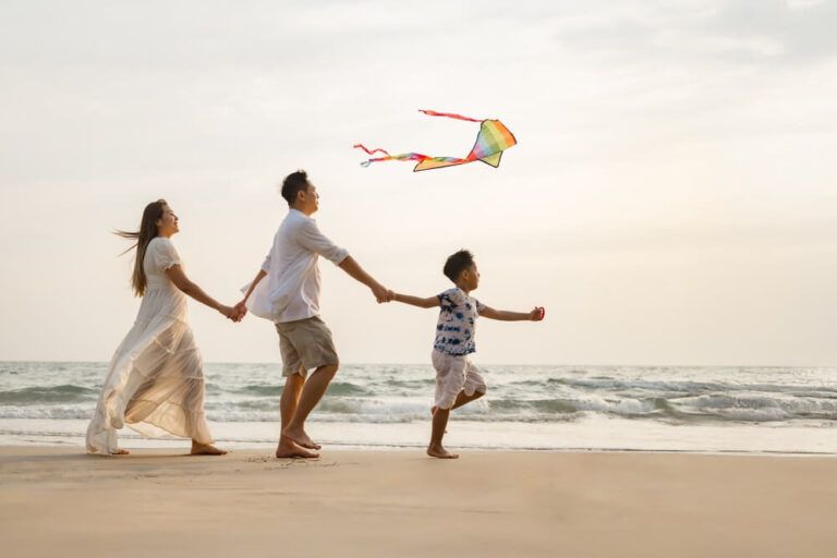 Asian family activity beach weekend together