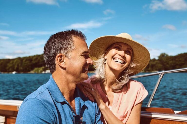 Mature couple, retirement and yacht cruise for relax, bonding and holiday on ocean together with love