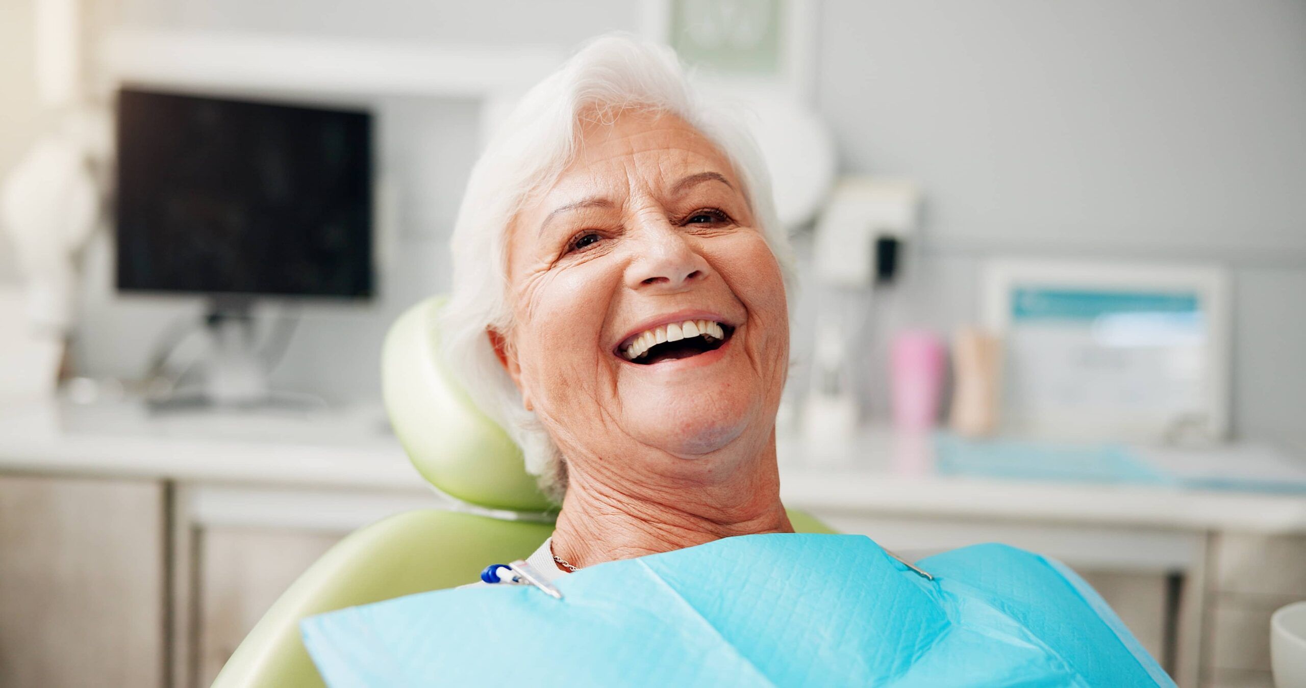 Portrait, smile and senior woman at dentist for teeth whitening results, dentures or oral hygiene