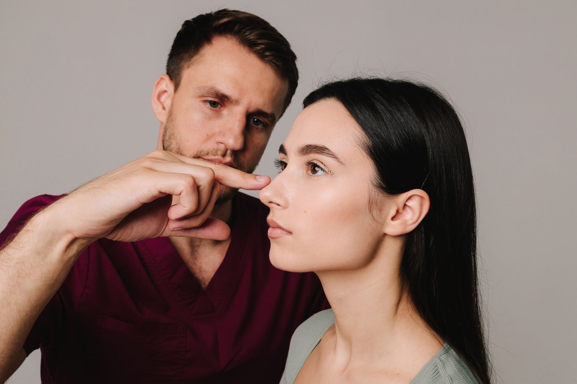 Rhinoplasty. Woman is going through nose surgery to constantly remove dorsal hump