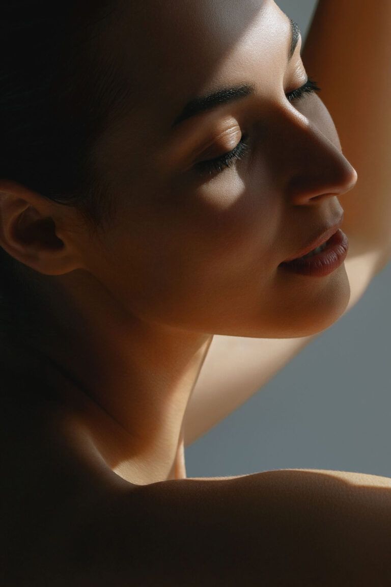 Gentle beautiful woman posing in sunlight. Daily skin care and beauty. Morning mood and lifestyle