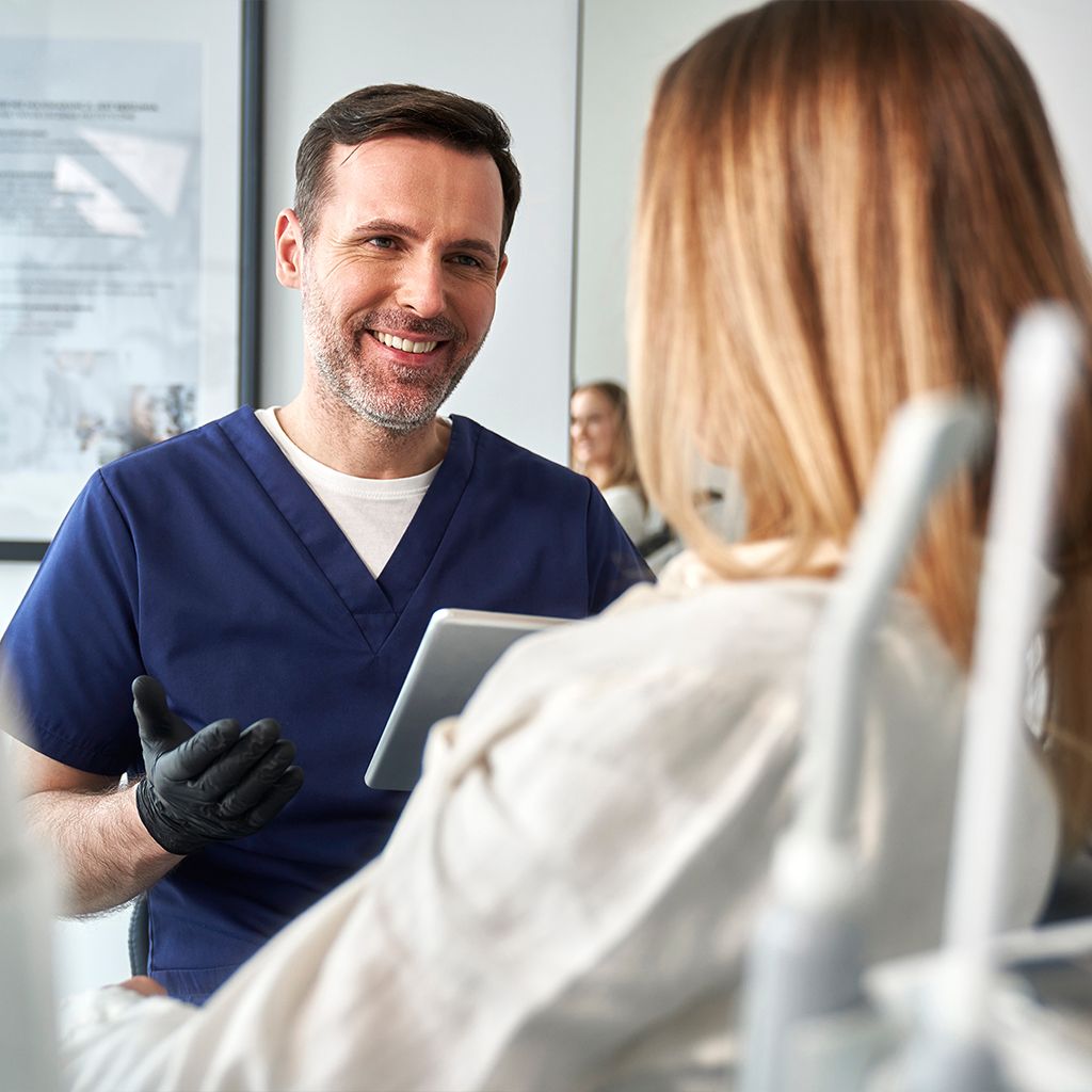 dentist consulting female patient