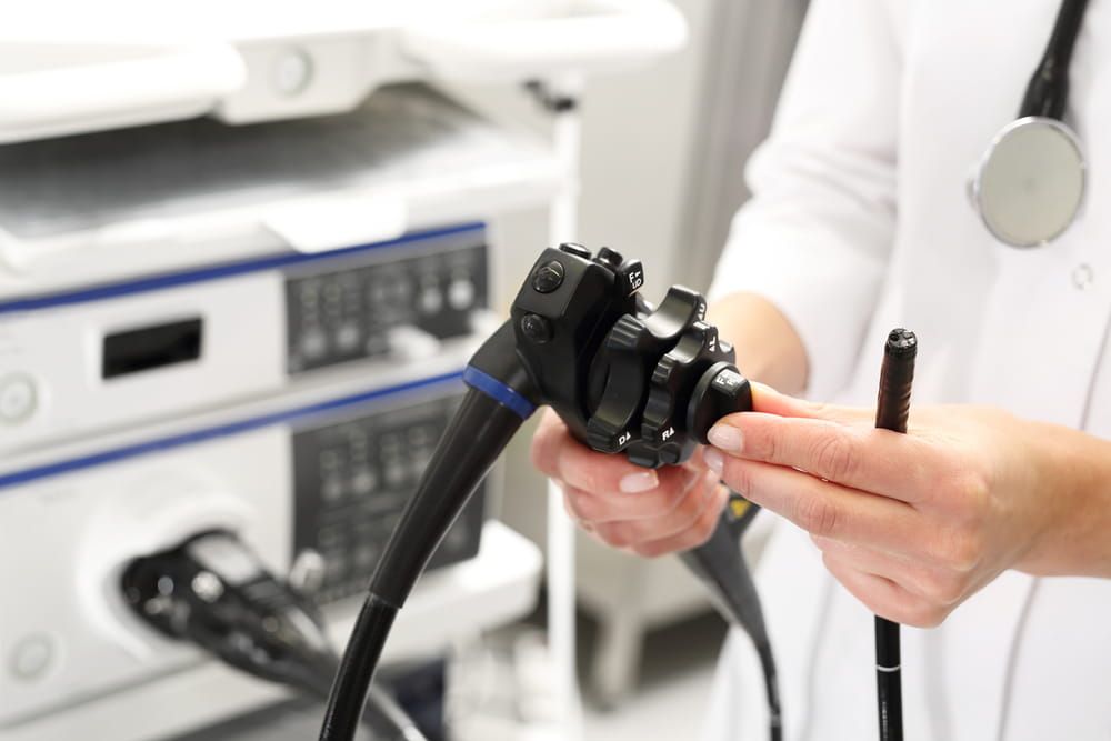 Probe colonoscope. Doctor gastroenterologist with probe to perform gastroscopy and colonoscopy