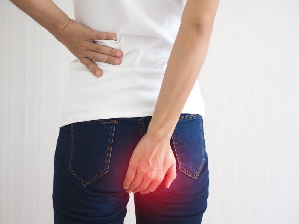 Anorectal abscess and anal fistula in asian woman symptom of pain and suffering. health care concept