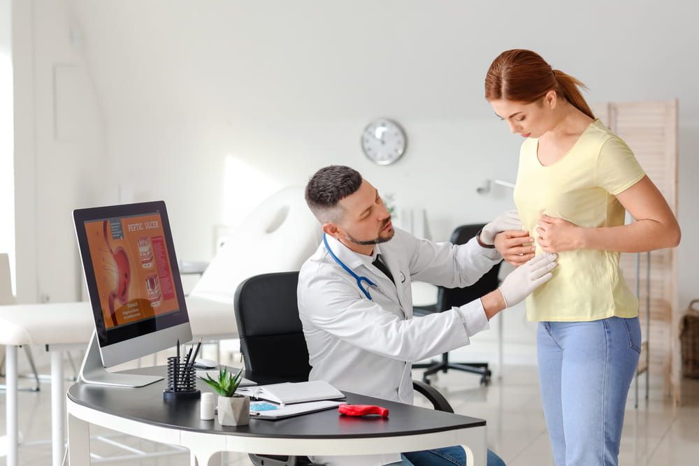 Woman visiting gastroenterologist in clinic