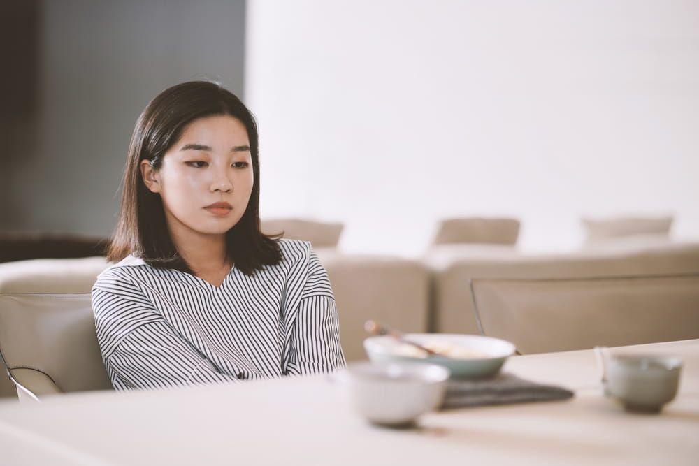 Asian young woman eating food