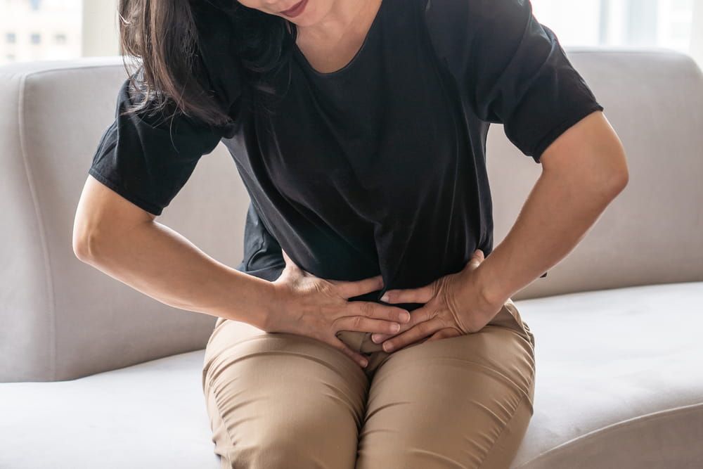Abdominal pain in woman with stomachache illness