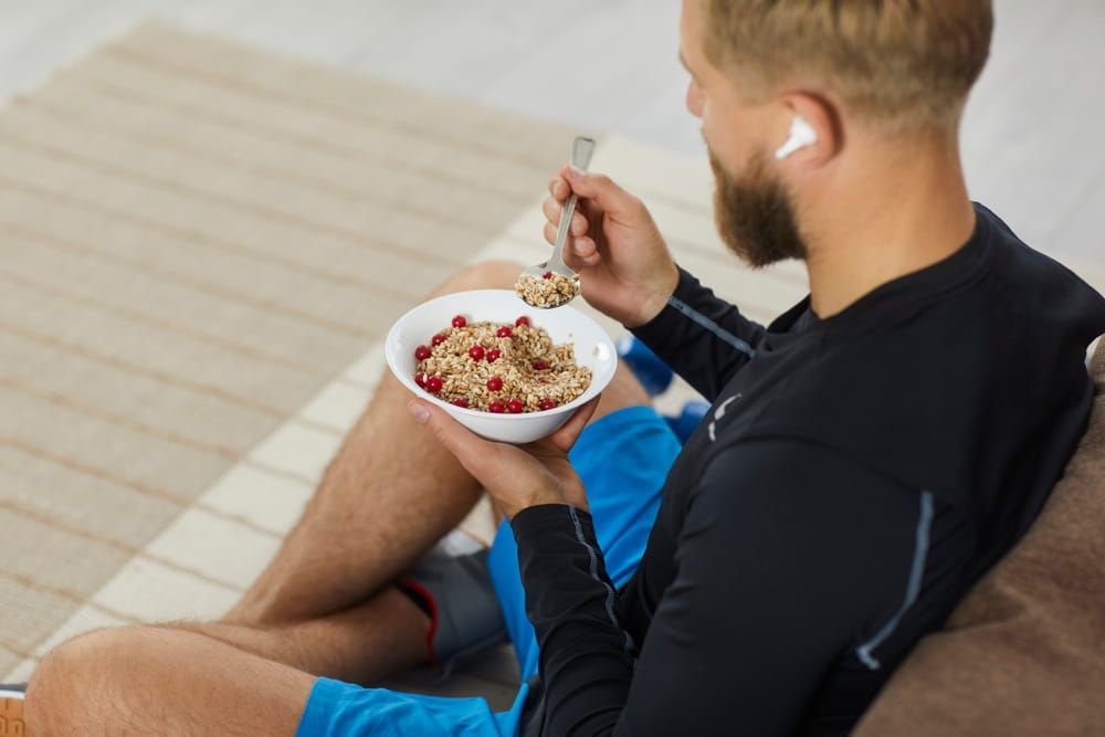 Athlete enjoying healthy meal rich in fiber, protein and vitamins
