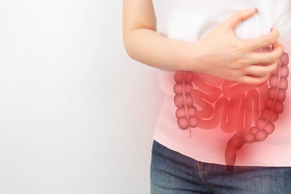 Woman suffering from Digestive tract problems include colitis, IBS