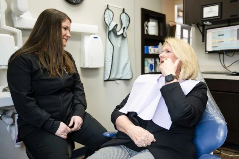 Dental Assistant talking to patient