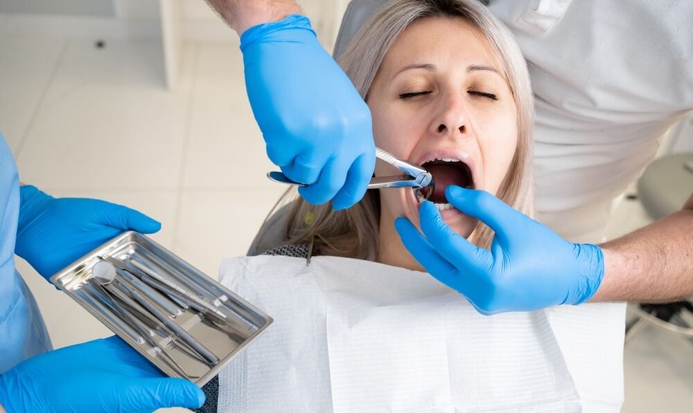 close-up of the poor girl's mouth in the bib of the patient in the dental clinic