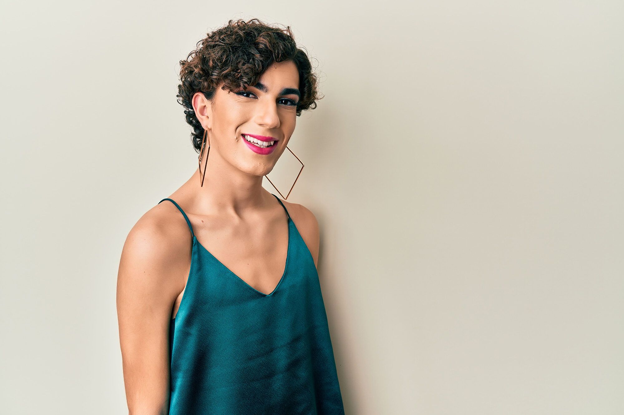Young transgender man wearing make up and woman clothes