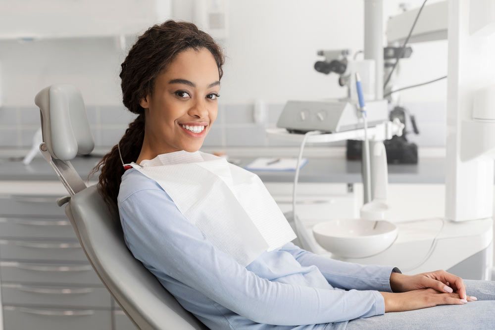 a person sitting comfortably in a modern dental examination chair