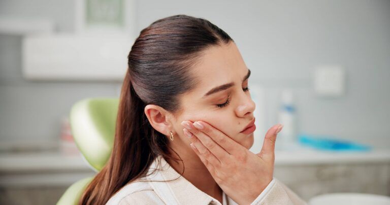 Woman, toothache and stress at dentist with pain, cavity or rotten tooth at oral care clinic