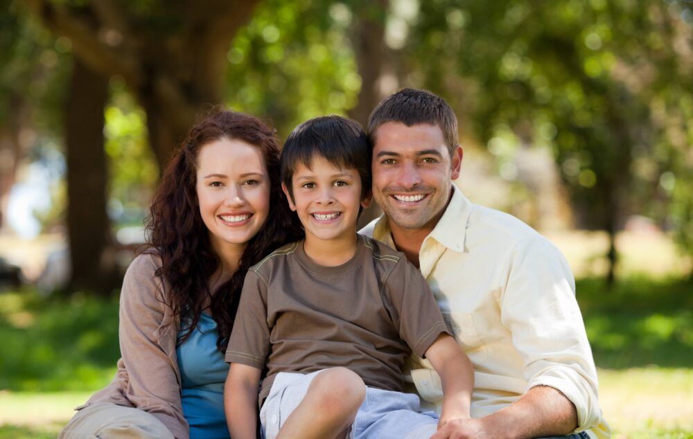 Joyful family sitting in the garden