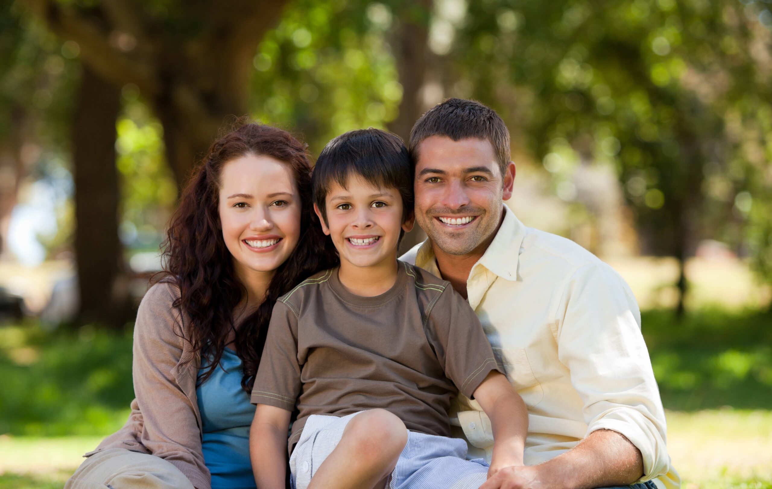 Joyful family sitting in the garden