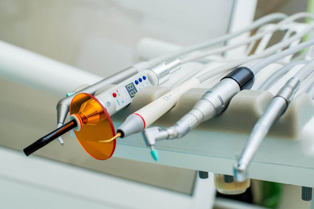 a set of dental handpieces and tools used in dentistry