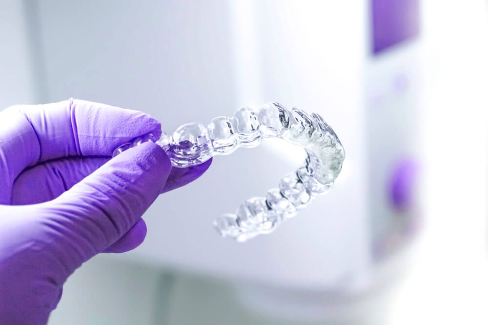a set of clear aligners, specifically from the Invisalign brand