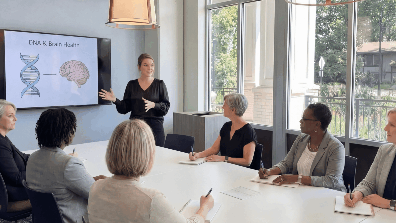 Women presenting DNA & Brian Health presentation to affluent women