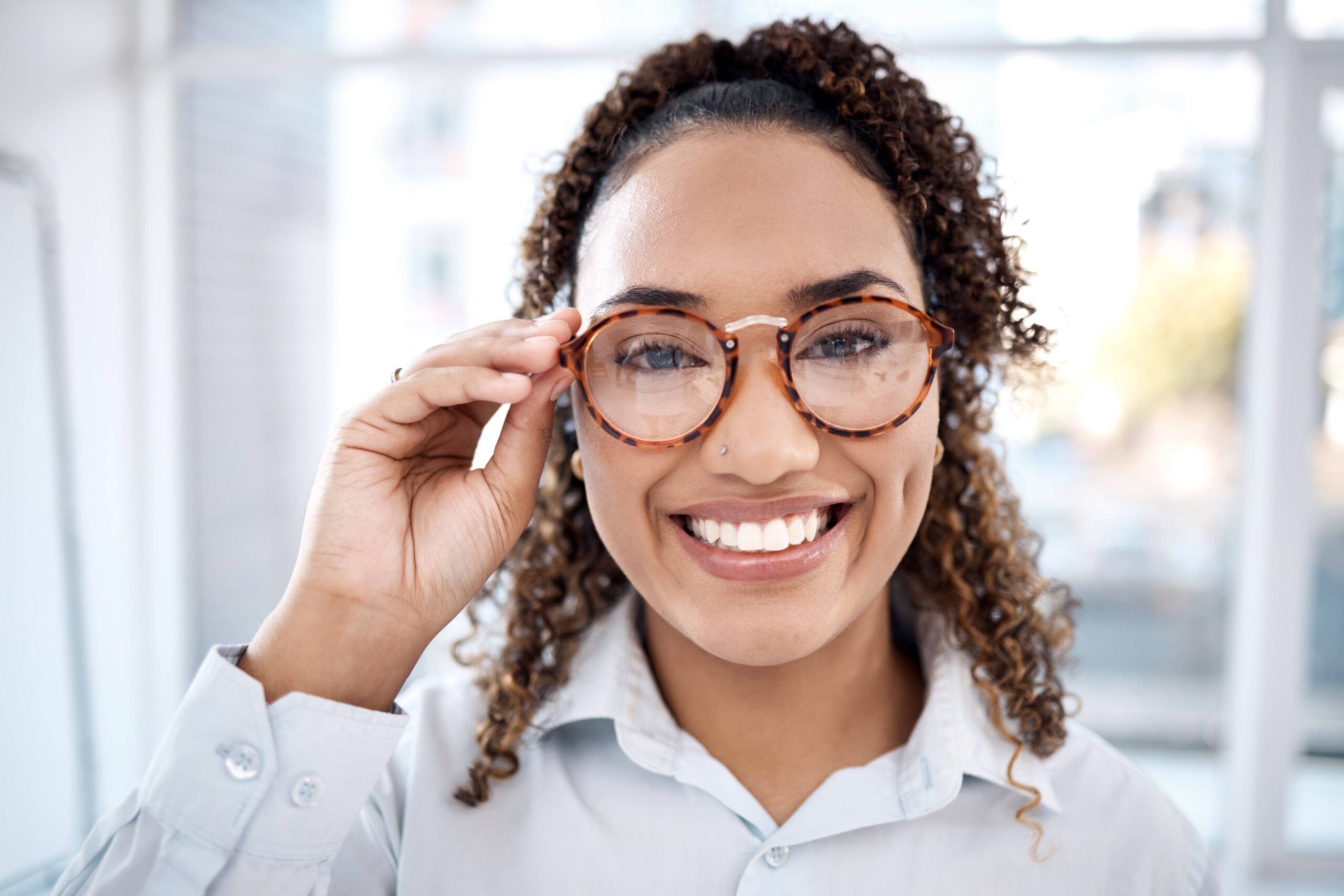 Optometry, smile and portrait of black woman with glasses for eye exam, sight and vision testing at clinic.