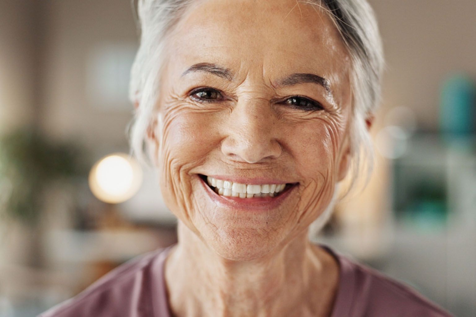 Mature woman, portrait and smile with dental treatment, whitening results and cleaning confidence