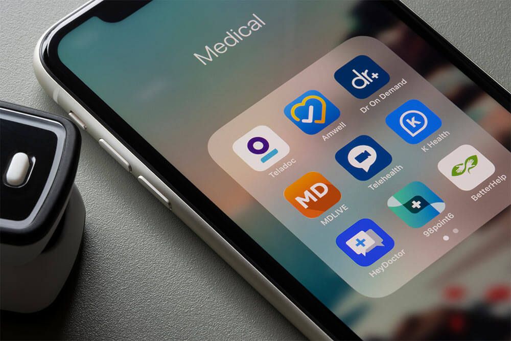 Assorted telehealth apps are seen on an iPhone