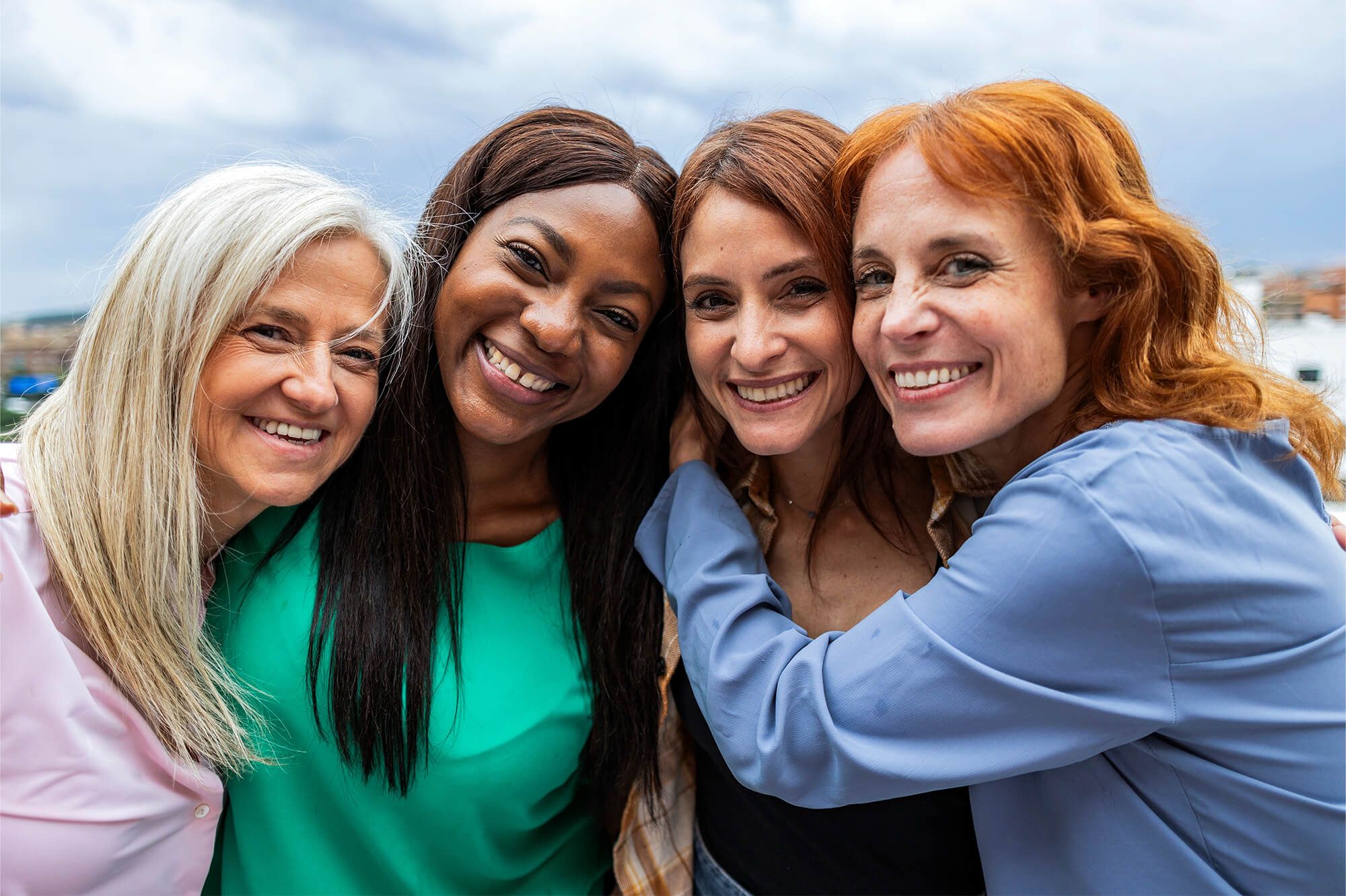 Four Diverse Women Friends Smiling Together