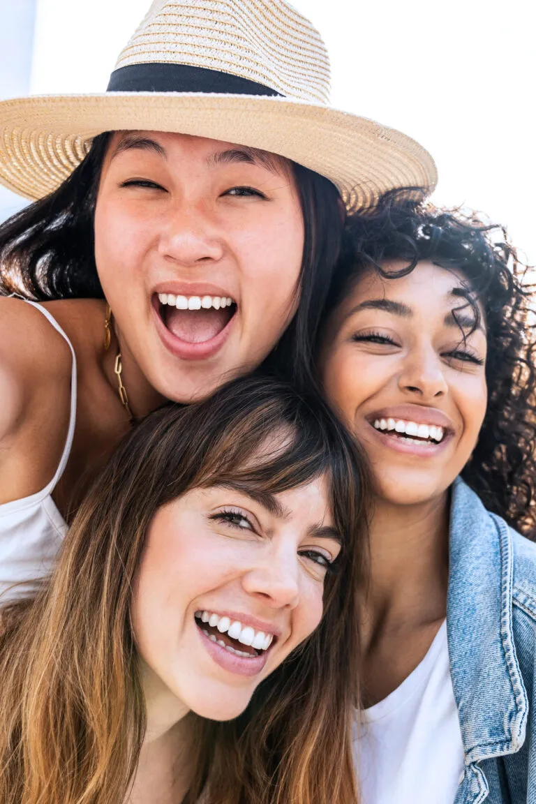 group of three female smiling