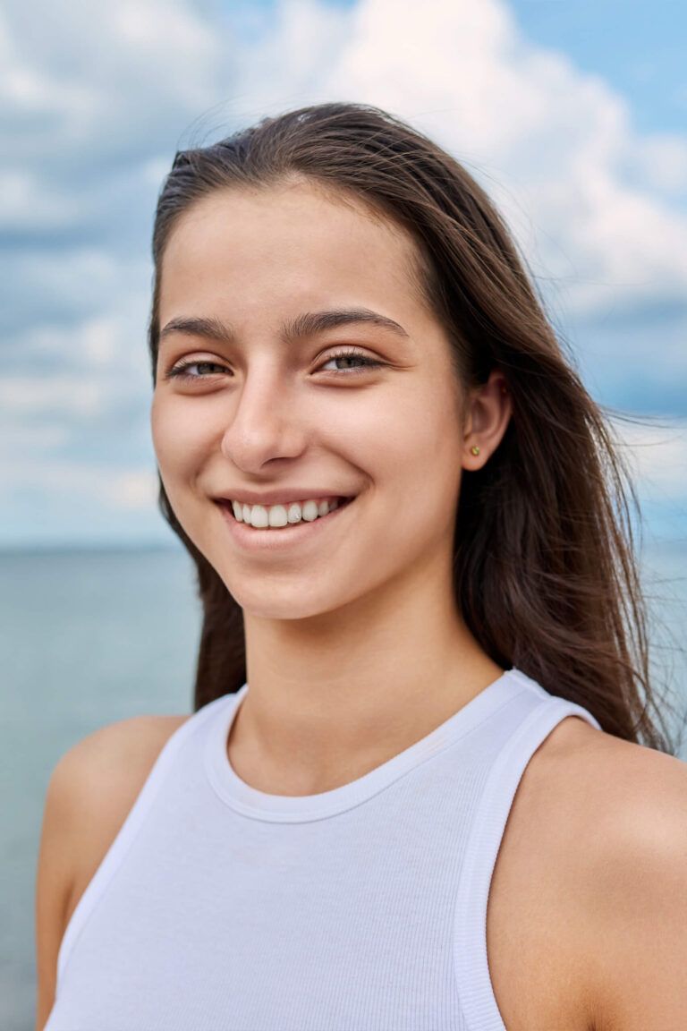 Portrait of a beautiful woman smiling at sea