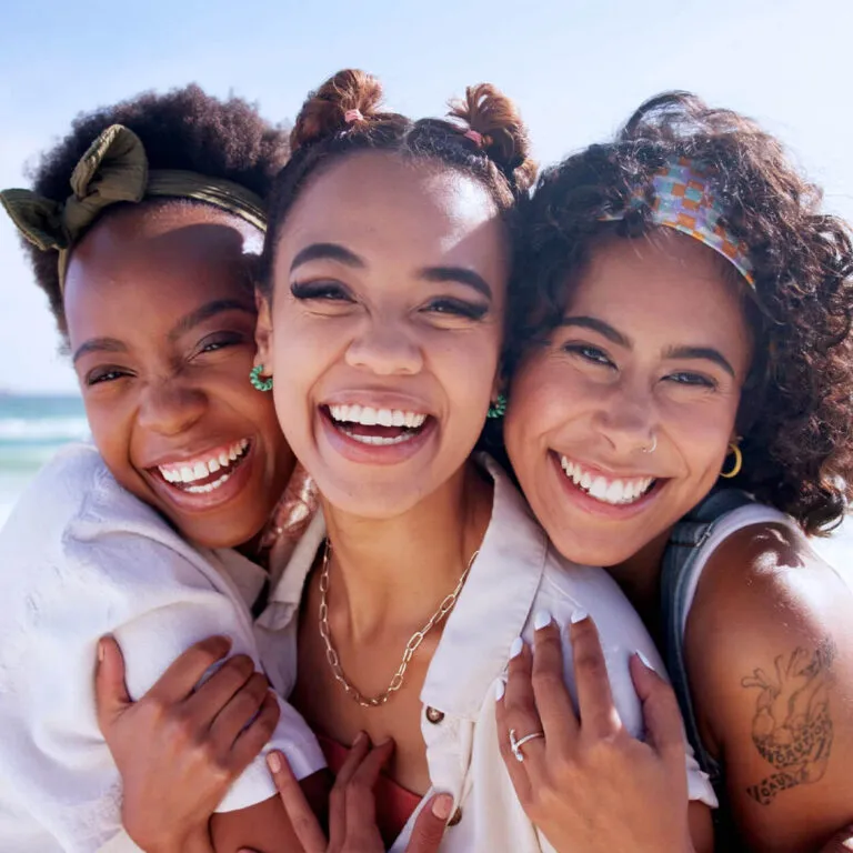 group of three female smiling