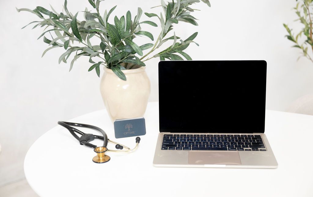Laptop and stethoscope on a table